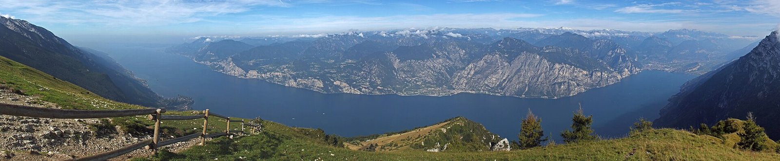 Lake Garda and the mountains of its western shore, seen from the grassy slopes of Monte Baldo