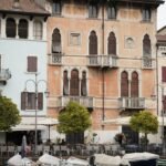 Charming Venetian-style architecture by the waterfront in Desenzano del Garda, Italy.