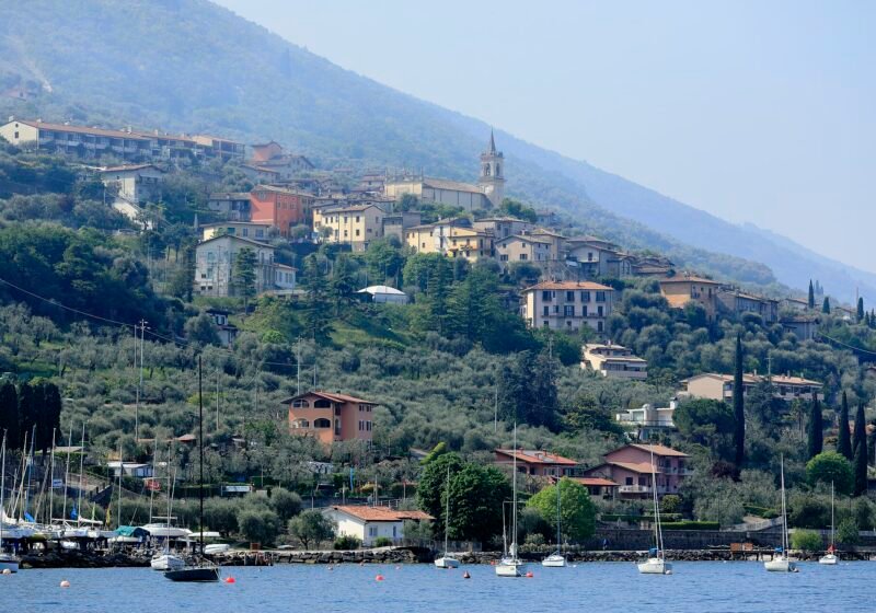 Borago and the hamlets of Brenzone sul Garda climbing the slopes of Monte Baldo, seen from the lake