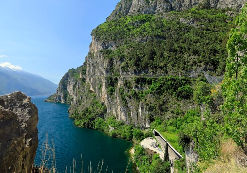 Old Ponale road cut into the wooded cliffs of the Val Sperone above the northern lake